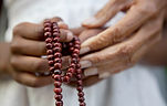 Hands Holding Beads