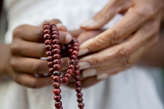 Hands Holding Beads