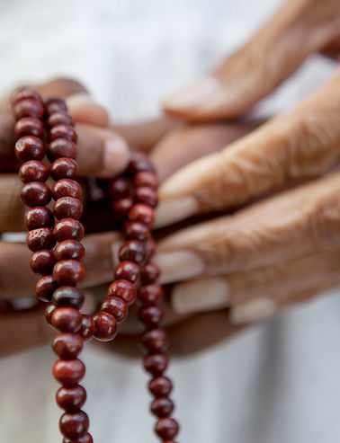 Hands Holding Beads