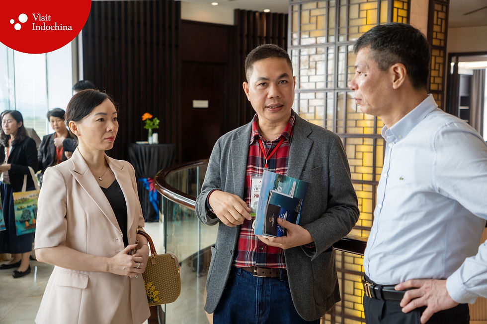 Nguyen Son Thuy CEO Visit Indochina discussing tourism cooperation with partners at Quang Ninh event.
