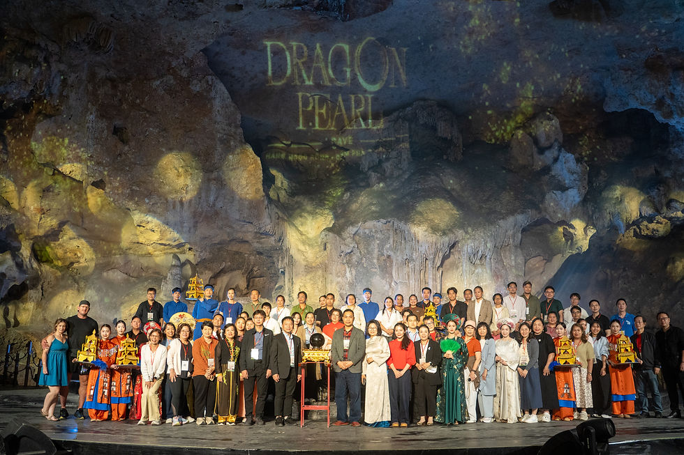 Visit Indochina and Thai travel agents join group photo at Dragon Pearl cave show in Quang Ninh Vietnam.