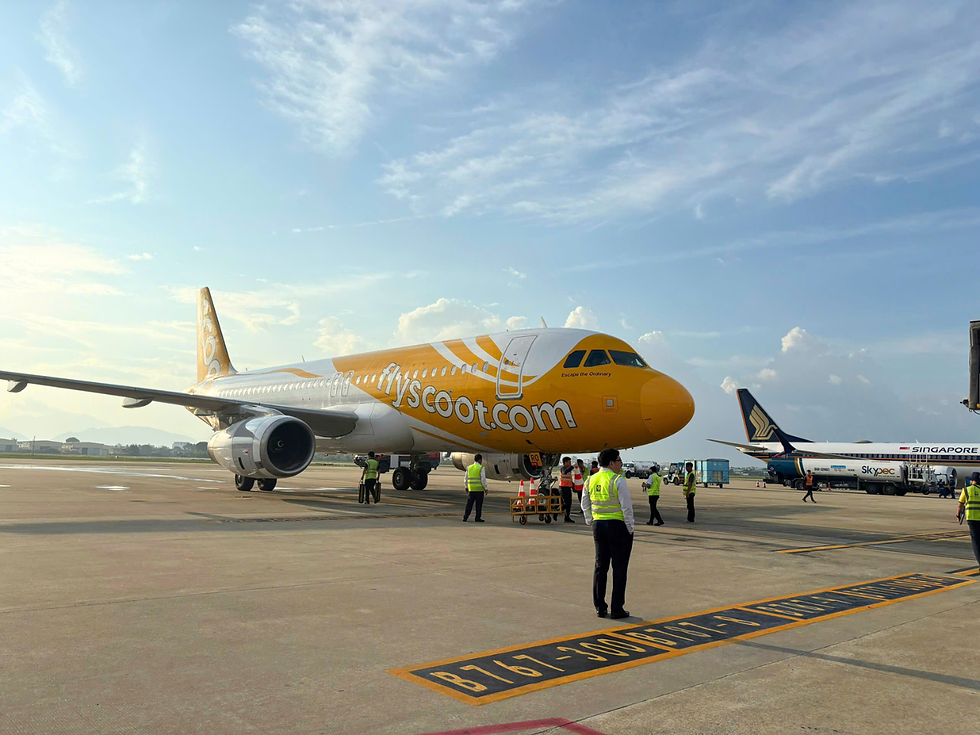 Scoot Airlines Airbus A320 with its signature yellow livery parked at Da Nang International Airport after completing the inaugural Singapore–Da Nang flight.