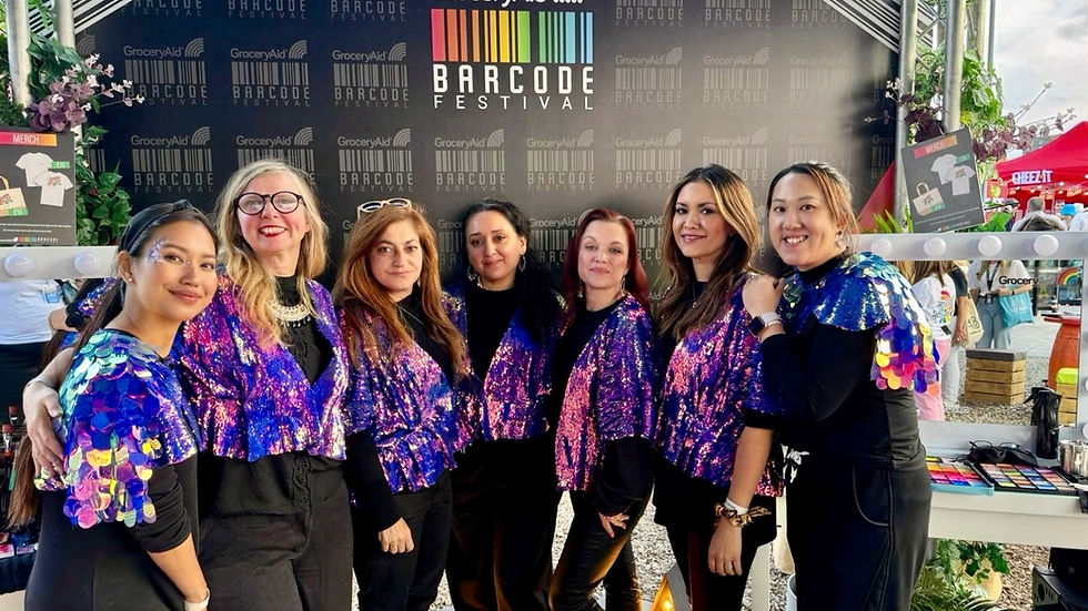 Glitter-arty glitter artists, face painters working at a large corporate festival London