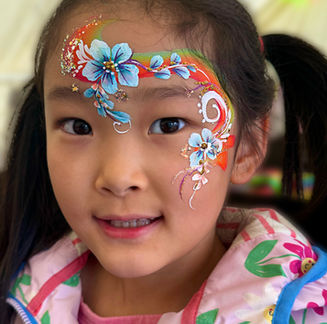 corporate event entertainment rainbow face painting