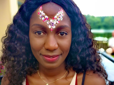 festival floral face paint with glitters and gems