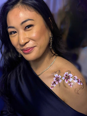 Glitter face painting design at London corporate evening event