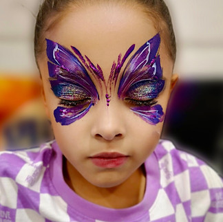 purple glitter butterfly face painting