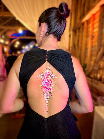 Elegant evening corporate event back body painting with glitter and roses