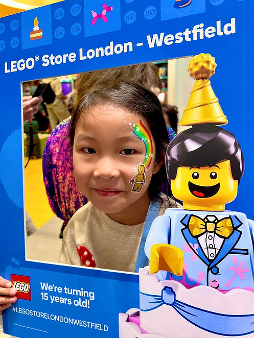 Children’s face painting at a LEGO Store event