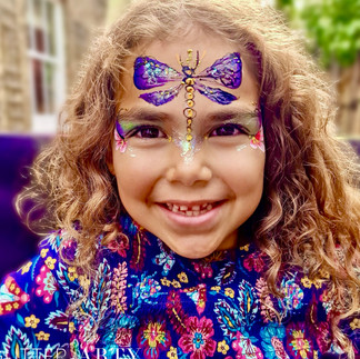 butterfly face painting purple wings