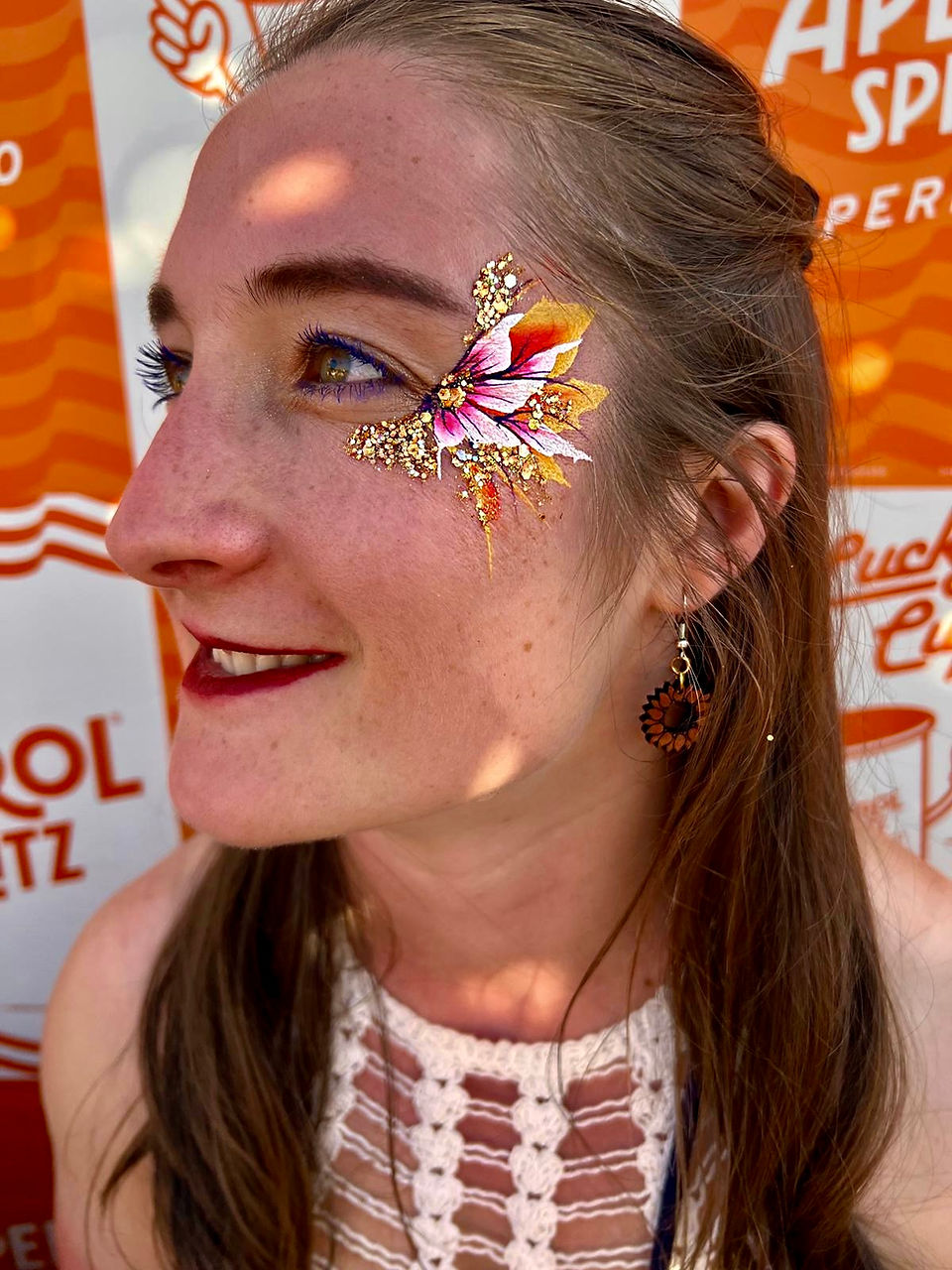     estival face painting with colourful plant-based glitter at BST Hyde Park