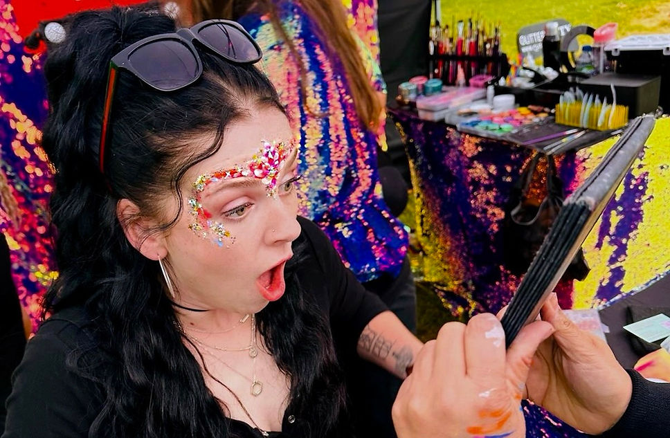 festival glitter makeup created at a corporate festival
