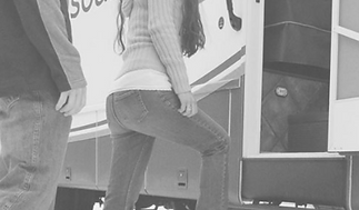 Woman stepping onto bus