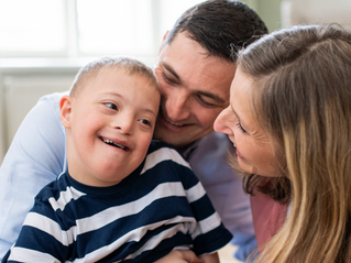 A family with their son who lives with Down Syndrome