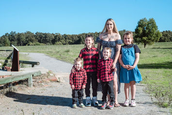 perth-family-photographer-captures-mum-with-3-boys-in-red-plaid-shirts-and-one-girl-in-blue-dress-at-perrys-paddock