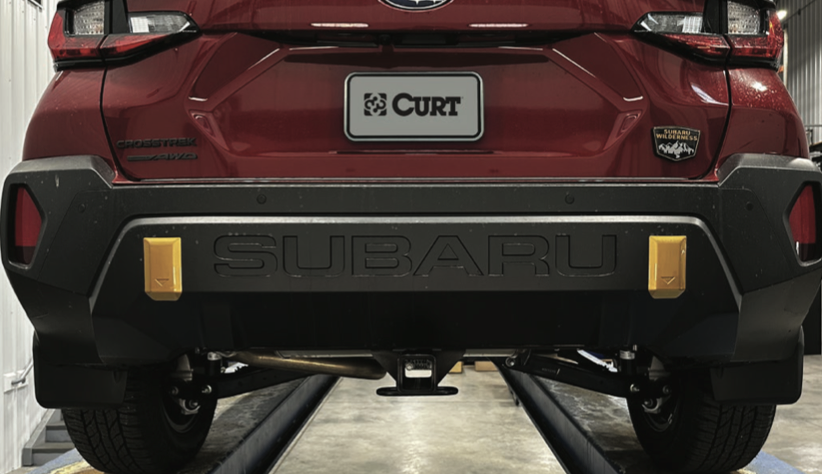 Rear view of a 2024 or newer Subaru Crosstrek Wilderness with a professionally installed trailer hitch