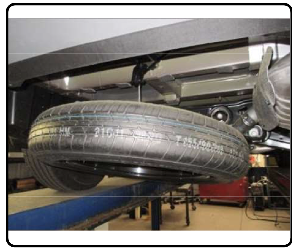 Kia Telluride spare tire lowered to prepare for trailer hitch installation
