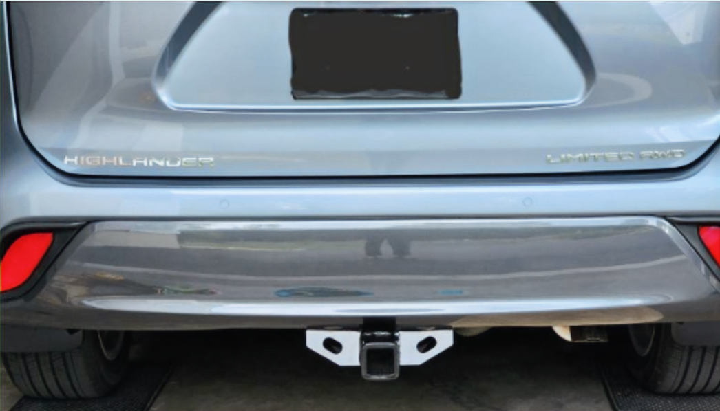 Rear view of a Toyota Highlander prepared for professional trailer hitch installation