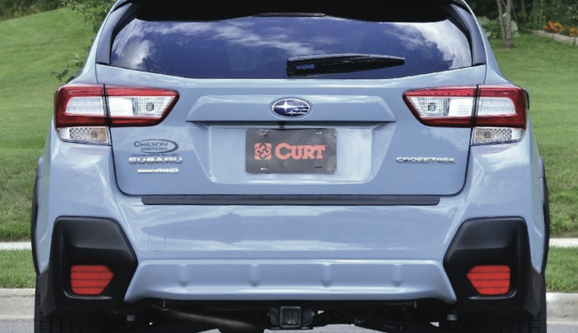Rear view of a 2024 or newer non-Wilderness Subaru Crosstrek with a professionally installed trailer hitch