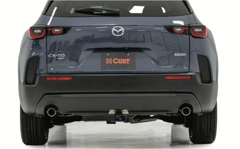 Mazda CX-50 with a professionally installed trailer hitch through the factory access-panel area