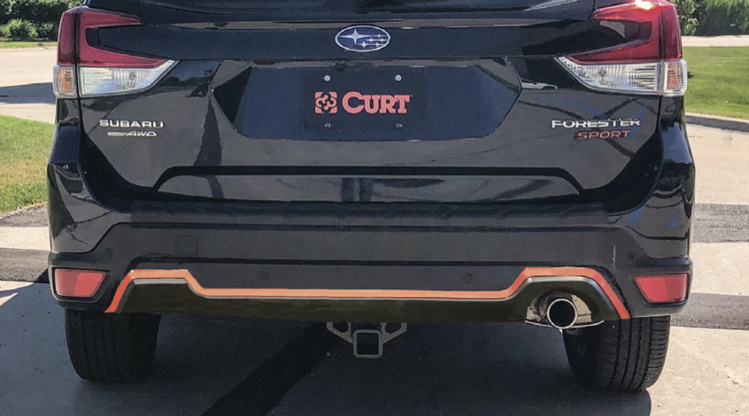Rear view of a 2019 or newer Subaru Forester with a professionally installed hidden trailer hitch