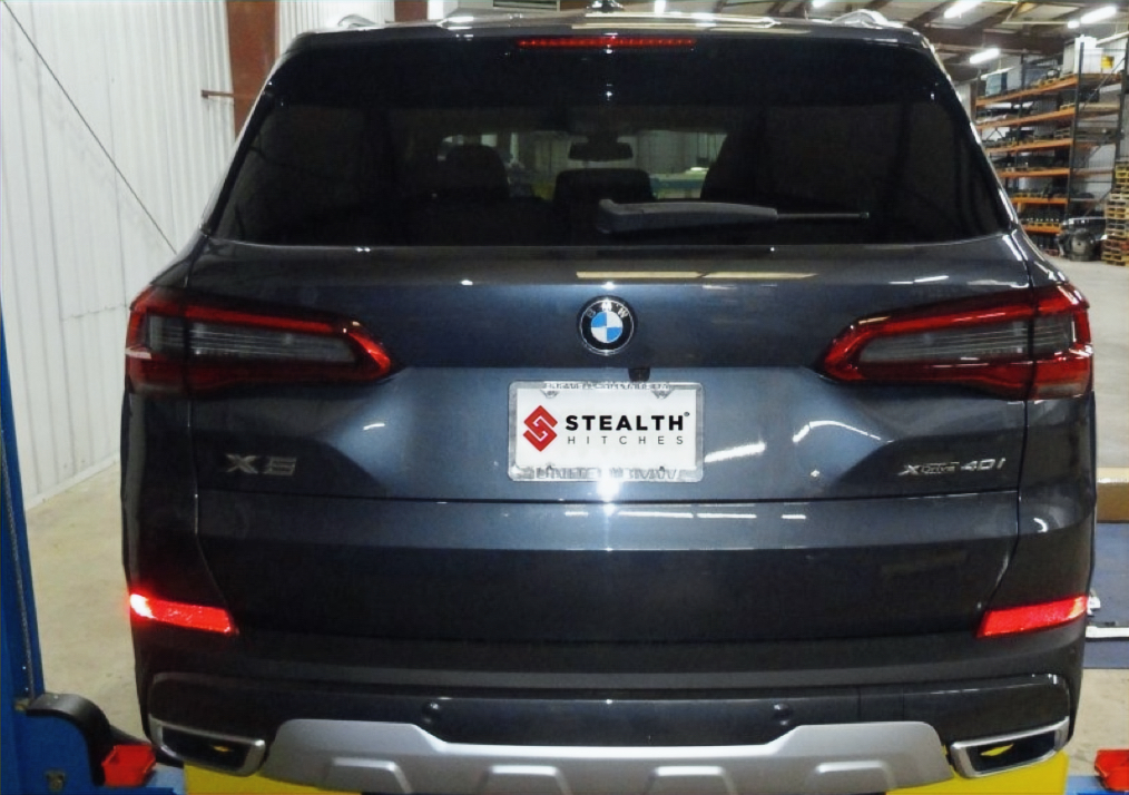 BMW X5 with a professionally installed Stealth Hitch concealed behind the bumper