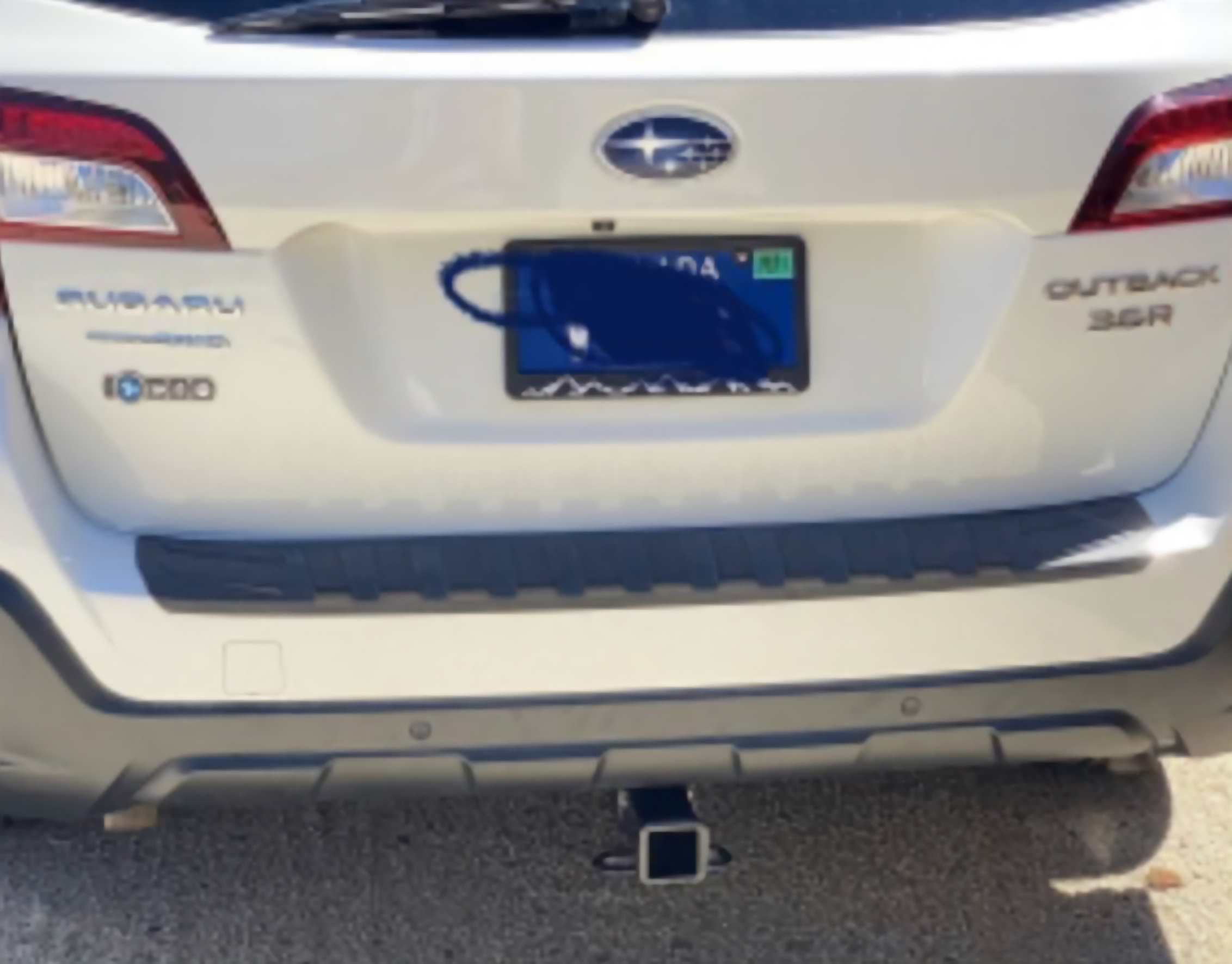 Rear view of a 2010–2019 Subaru Outback with a professionally installed trailer hitch