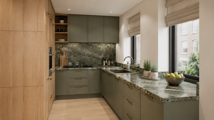 Green kitchen with oak cabinetry, marble worktops, brass handles and roman blinds