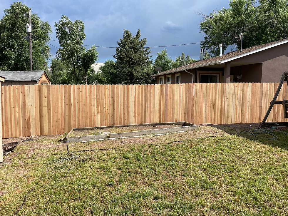 New wooden privacy fence from exterior home carpentry services.