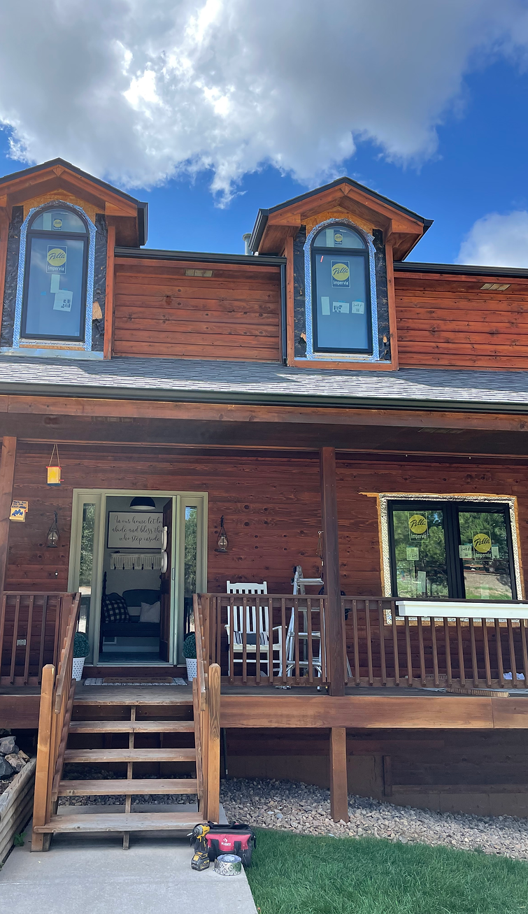 Exterior home carpentry services for a cedar log cabin.