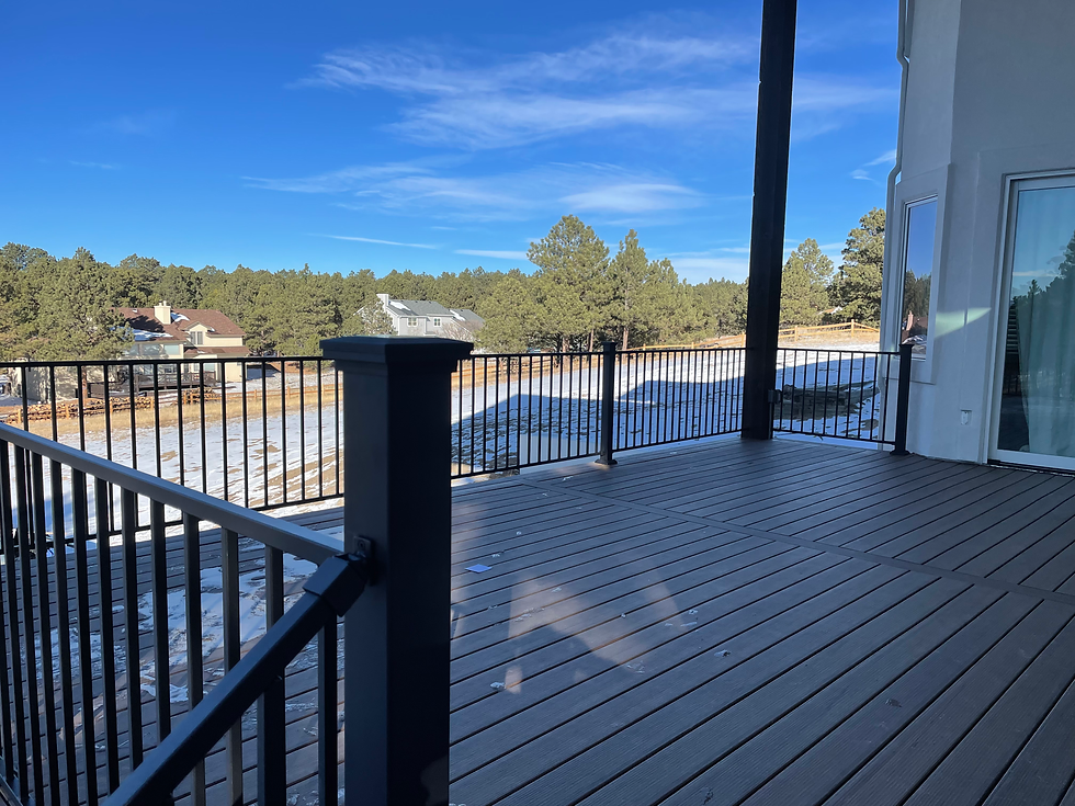 Modern deck with black railing and exterior home carpentry services