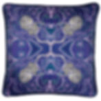 Product shot of a decorative & colourful silk cushion with a snow leopard tile repeat pattern on it