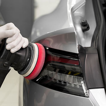 Professional paint correction using polishing machine on car surface