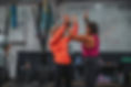 women high fiving after crossfit class