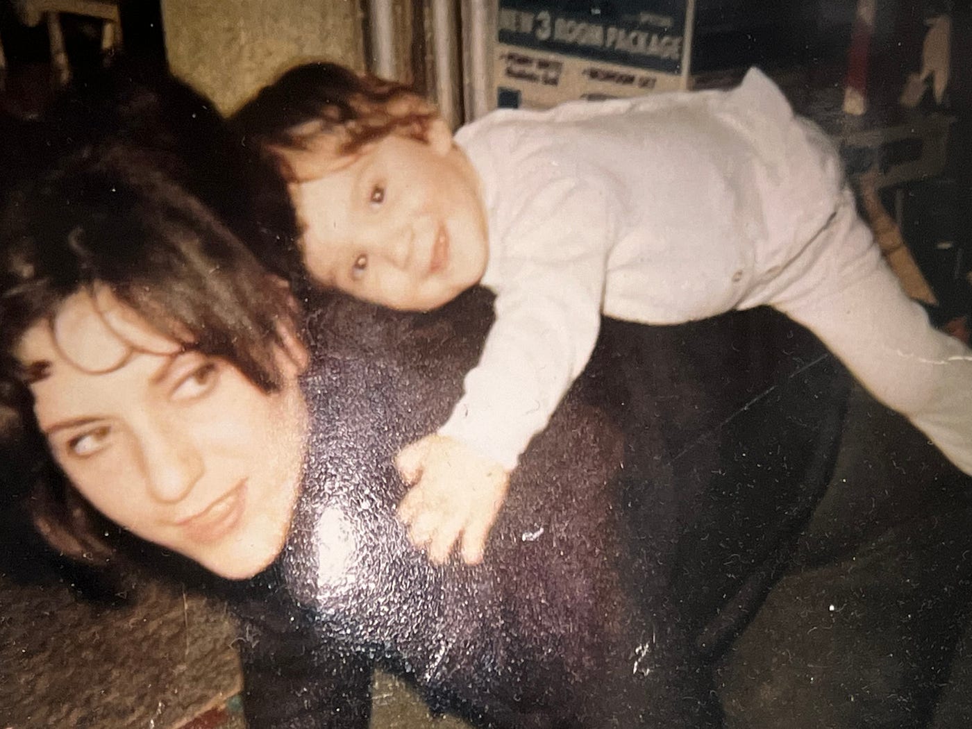 My baby sister Pamela riding on my mother in Germany