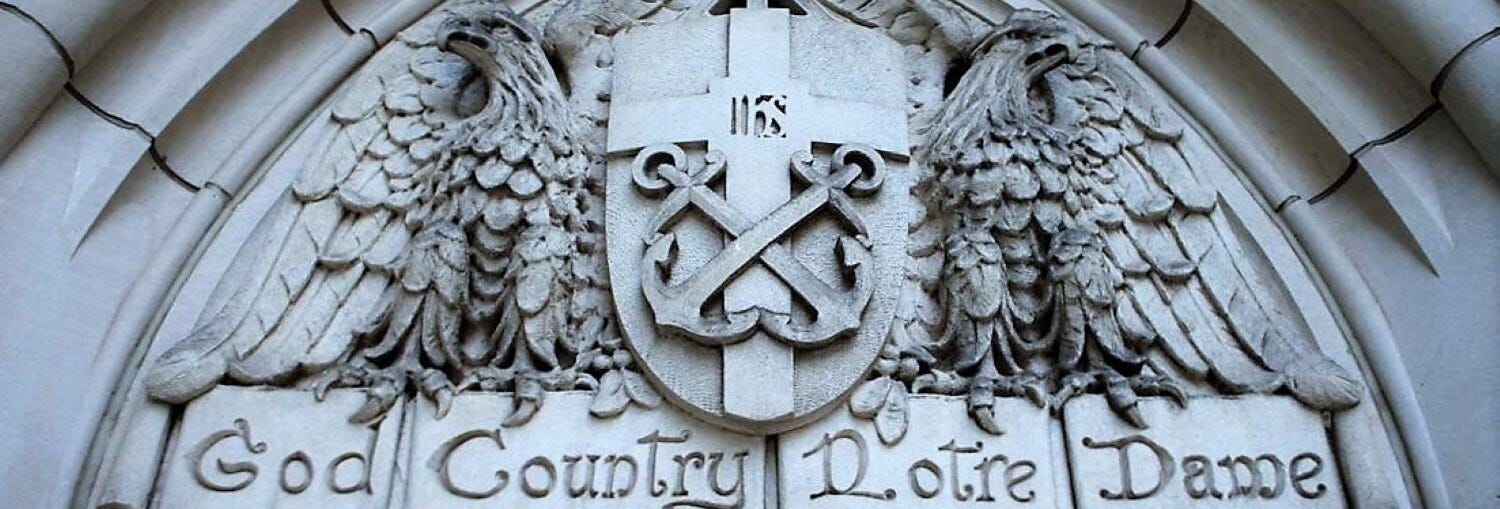 Entrance to building at the University of Notre Dame with "God, Country, Notre Dame" slogan.  Autobiography of Dr. Anthony J. Carbone.