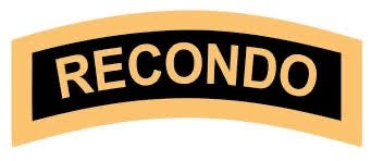 Black and Gold RECONDO tab to be worn on shoulder sleeve.  Biography of Dr. Anthony J. Carbone.