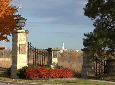 Front Gate to Fort Leavenwork, Kansas where the Command & General Staff College is located.After returning from his first tour in Vietnam in 1967, my father received prestigious orders to attend the United States Army Command and General Staff College (CGSC) at Fort Leavenworth, Kansas. This wasn’t just another stop on the military carousel — it was a pivotal milestone in his ascending career. Being selected early for CGSC was a mark of distinction. It signaled that the Army saw him not only as a skilled officer but as a leader with long-term potential.Front Gate to Fort Leavenworth, KansasThe Command and General Staff College is one of the crown jewels of military education. Established in 1881 by General William Tecumseh Sherman as the School of Application for Infantry and Cavalry, it was designed to train officers in the complexities of tactics, operations, and command. By 1907 it had become the School of the Line, and eventually evolved into what is now CGSC. Its mission remains timeless: to educate and develop agile, adaptive leaders who can operate in joint, interagency, and multinational environments — and to advance the art and science of the profession of arms.Seal of the U.S. Command & General Staff College at Fort Leavenworth, KansasMy father knew that the college had shaped some of America’s greatest military minds. Its alumni list reads like a hall of fame: Eisenhower, MacArthur, Marshall, Patton, Bradley, Westmoreland, and later, Colin Powell and Norman Schwarzkopf. To follow in their footsteps — even to walk the same halls — was both humbling and inspiring.Since on-post housing was limited and claimed quickly, our family settled down in a modest townhouse in a small civilian development called Redwood Gardens, located about 35 miles southeast of Fort Leavenworth, in Kansas City, Kansas. Though a few other military families lived there, it lacked the closeness, safety, and camaraderie of post living. For us kids, it was an isolating and sometimes chaotic environment.Civilian housing at Redwood Gardens in Kansas City, Kansas.Our townhouse was cramped. My father turned a corner of the basement into a makeshift study where he would disappear for hours, immersed in maps, doctrine, and war histories. The workload at CGSC was intense, and the pressure to excel immense.Carbone Family Portrait in the Command & General Staff College Yearbook “The Bell”My own memories of Kansas City during that time are scattered and, for the most part, not especially fond. That year seemed filled with accidents and discomfort. Pamela fell down the basement stairs and had to get stitches on her face. Diana dove into the shallow end of the neighborhood pool and broke her front tooth in half, eventually receiving a dental cap. I got into a fight when I saw a bully beating up a younger kid — jumped in, broke my hand, and spent the rest of the summer in a cast.One of my more cherished memories I have of our time in Kansas City was the day that Lynne, Diana, and I were all confirmed in the Catholic Church — on the same day — by the Archbishop of Kansas City, Bishop Edward Joseph Hunkeler. It was a peaceful and proud moment in an otherwise trying year.On weekends when my father could sneak away from his studies, we would occasionally, we would make a special trip into the Italian section of Kansas City to stock up on authentic cold cuts — thin slices of mortadella, prosciutto, and provolone cheese — all tucked lovingly into crusty loaves of Italian bread. The vibrant tapestry of Kansas City in 1967 was interwoven with the rich history of its Italian community, particularly in the neighborhood then known as the North End. Having drawn immigrants — mostly from Sicily — since the 1860s, this area, which would soon be renamed Columbus Park, bustled with life centered around Holy Rosary Church and its many family-owned shops and markets. This self-sufficient “Little Italy” offered more than just delicious food — it was a place where tradition, language, and community thrived. Even as changes like the construction of Interstate 35 began to carve through its heart and displace families, the neighborhood remained a beloved reminder of cultural roots and Sunday flavors that felt like home.Columbus Park “Little Italy” in Kansas CityBut another memory stands out even more clearly — not for its peace, but for its intensity. Just a few doors down from our townhouse lived a parentless family of unruly boys who had clearly slipped through the cracks. They had long, unkempt hair — a growing trend in the late 1960s — and I remember them smoking on their back steps, jeering at us as we passed. One day, they went too far and scared my mother. That was a mistake.I’ll never forget the moment my father found out. He calmly called out, “Hey, J.R.! Come with me!” and together we stepped into the backyard and walked down the road toward the rough boys’ unit. My father knocked on the door, and the oldest, cockiest of them answered. My father made it very clear: he didn’t want any of them speaking to his wife or his children again.The kid smirked and said something along the lines of, “What is it to you? I don’t plan on stopping.” Without hesitation, my father grabbed the kid by his long hair and — in a move I can only describe as quiet thunder — drew his service Colt 1911 .45 caliber pistol and placed it gently but firmly under the boy’s jaw. His voice was low, measured, deadly calm. “This will be the last time that I warn you.” Then he released the boy, turned to me, and said evenly, “J.R., let’s get back to your mother… and never say a word about this to her.” That day left a mark on me. I had always admired my father, but in that moment, I saw him not only as a soldier but as a protector. I had never felt so safe in my life.Despite all the challenges of civilian housing, my heart always returned to the post of Fort Leavenworth. Some of my fondest memories of that tour are tied to my personal fascination with the history of the fort — especially its deep connections to the U.S. Cavalry. I was captivated by the legacy of General George Armstrong Custer and his 7th Cavalry, as well as the legendary Buffalo Soldiers of the 10th U.S. Cavalry — the same regiment my father had served with during his tour in Korea. I felt a personal connection to that history, one that ran through the bloodline of my own father.General George Armstrong Custor of the U.S. 7th Cavalry.Buffalo Soldiers of the U.S. 10th CavalryThe post was still very much a place of history. Many of the old red brick buildings from cavalry days still stood, preserved like time capsules from another era. I found myself drawn again and again to the Fort Leavenworth museum, which was filled with relics from Custer, the 7th Cavalry, and the 10th Cavalry. There were even artifacts and exhibits tied to President Abraham Lincoln’s visit to the post, which added another layer of reverence. My family often made Sunday day trips to the museum. Those quiet visits — walking through dusty uniforms, sabers, saddles, and faded photographs — lit a spark in me. Even as a child, I felt that Fort Leavenworth was hallowed ground.Typical post housing at Fort Leavenworth dating back to its cavalry days.The post itself dates back to May 8, 1827, when Colonel Henry Leavenworth established Cantonment Leavenworth along the Missouri River. It became the first permanent settlement in what would eventually become Kansas, and is today the oldest active Army post west of the Mississippi River. Originally serving as a quartermaster depot, arsenal, and garrison to safeguard the fur trade and commerce along the Santa Fe Trail, the post was briefly evacuated in 1829 and occupied by Kickapoo Indians before being re-garrisoned later that same year. On February 8, 1832, it was officially renamed Fort Leavenworth.General Henry LeavenworthOver time, the post developed a reputation not just as a military outpost, but as an intellectual center of the Army. It housed the prestigious Combined Arms Research Library (CARL), and it became a place where strategic thought and operational planning were forged and refined.Combined Arms Research Library at Fort Leavenworth/Yet there was another layer to Fort Leavenworth’s identity — its prisons. The United States Disciplinary Barracks (USDB), established in 1875, is the Department of Defense’s only maximum-security military prison. Right outside the gates, the Leavenworth Federal Penitentiary, operated by the Department of Justice, stood as a towering reminder of the civilian justice system’s reach.U.S. Disciplany Barracks at Fort Leavenworth, Kansas.Both institutions had reputations for housing some of the most notorious figures in American criminal and military history — from military murderers and spies to civilian outlaws like George “Machine Gun” Kelly, labor leader Eugene V. Debs, and Robert Stroud, the so-called Birdman of Alcatraz. Their stories seemed to hang in the air like myths. Even as children, we sensed the gravity of their presence, and we were always reminded not to stray too far from home. There was mystery and menace just over the horizon.U.S. Federal Penatentary at Leavenworth, Kansas.Despite the shadow cast by those prisons, Fort Leavenworth stood as a monument to something greater. It was a place of heritage, reflection, and deep military tradition. For my father, the CGSC experience was transformative. It shaped his approach to leadership and helped define the rest of his career. For our family, it was a time of adaptation, growing pains, and strength. And for me, Fort Leavenworth stirred something inside — an early reverence for history, heroism, and the cavalry legacy that connected us all.Dad receiving another medal at the Command & General Staff College with my mother by his side.