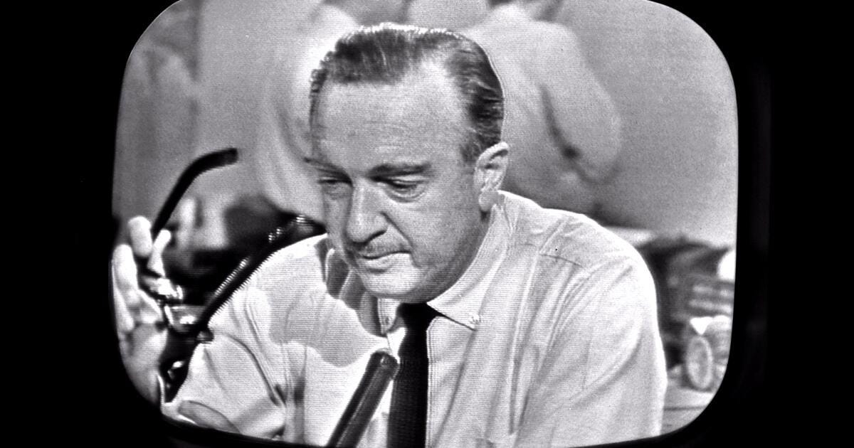 Walter Cronkite as he removes his glasses while announcing the death of President John F. Kennedy on CBS News, as seen from a television monitor on November 22, 1963.Dr. Carbone’s Autobiography: A Son in the Shadow of a Green Beret Hero