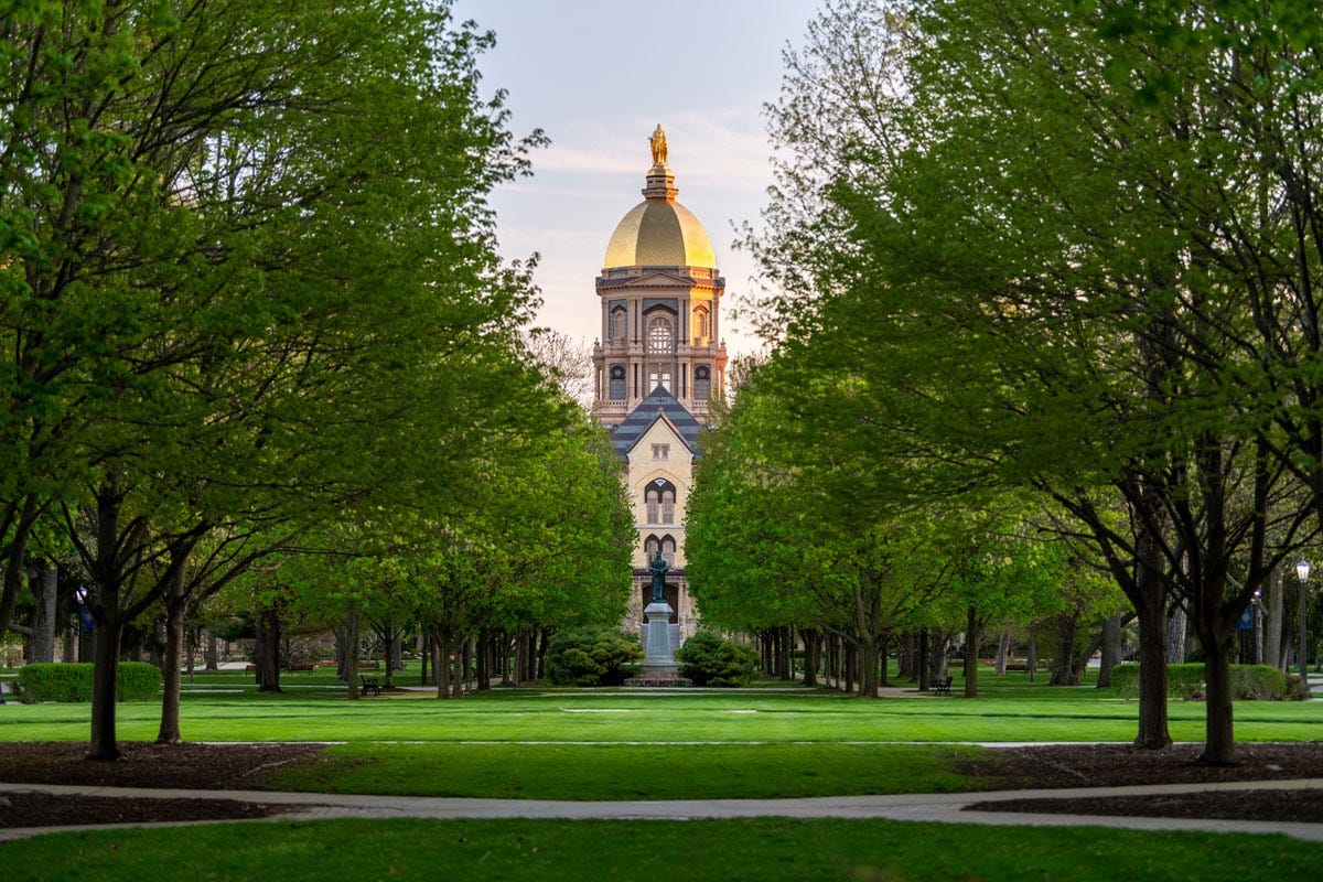 Administration Building with its iconic Golden Dome with statue of Our Lady of the Lake. University of Notre Dame. Dr. Carbone’s autobiography.