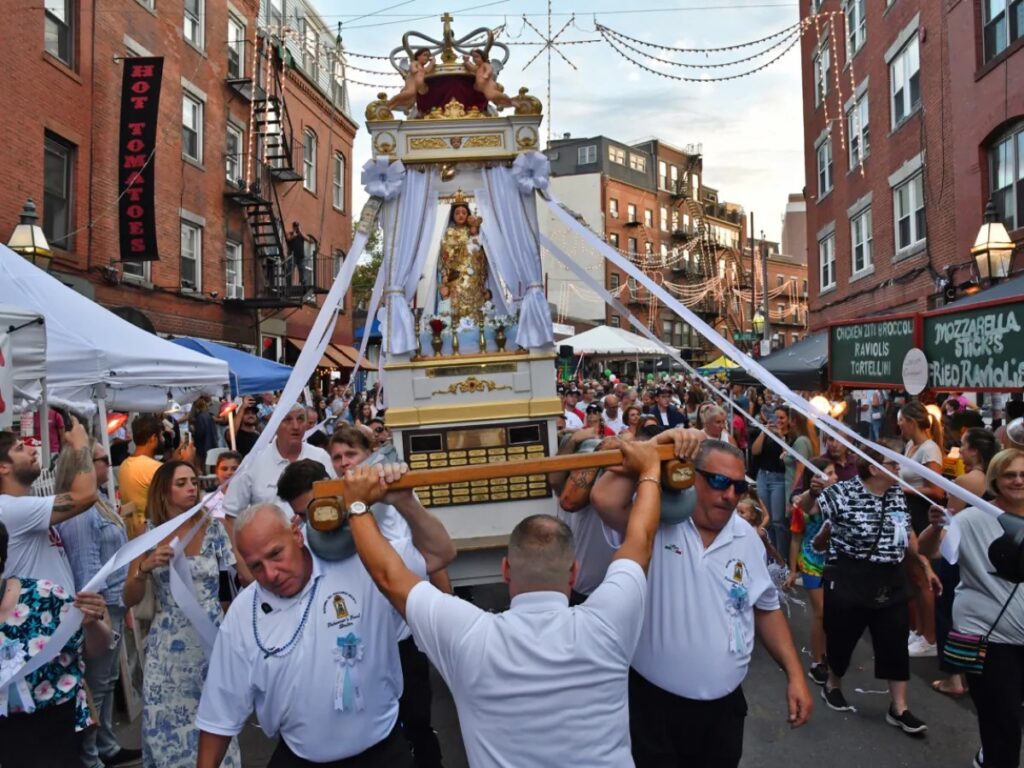 Photograph of the North End in Boston, Massachusetts during one of the Feast of the Saints parade.  Autobiography of Dr. Anthony J. Carbone.