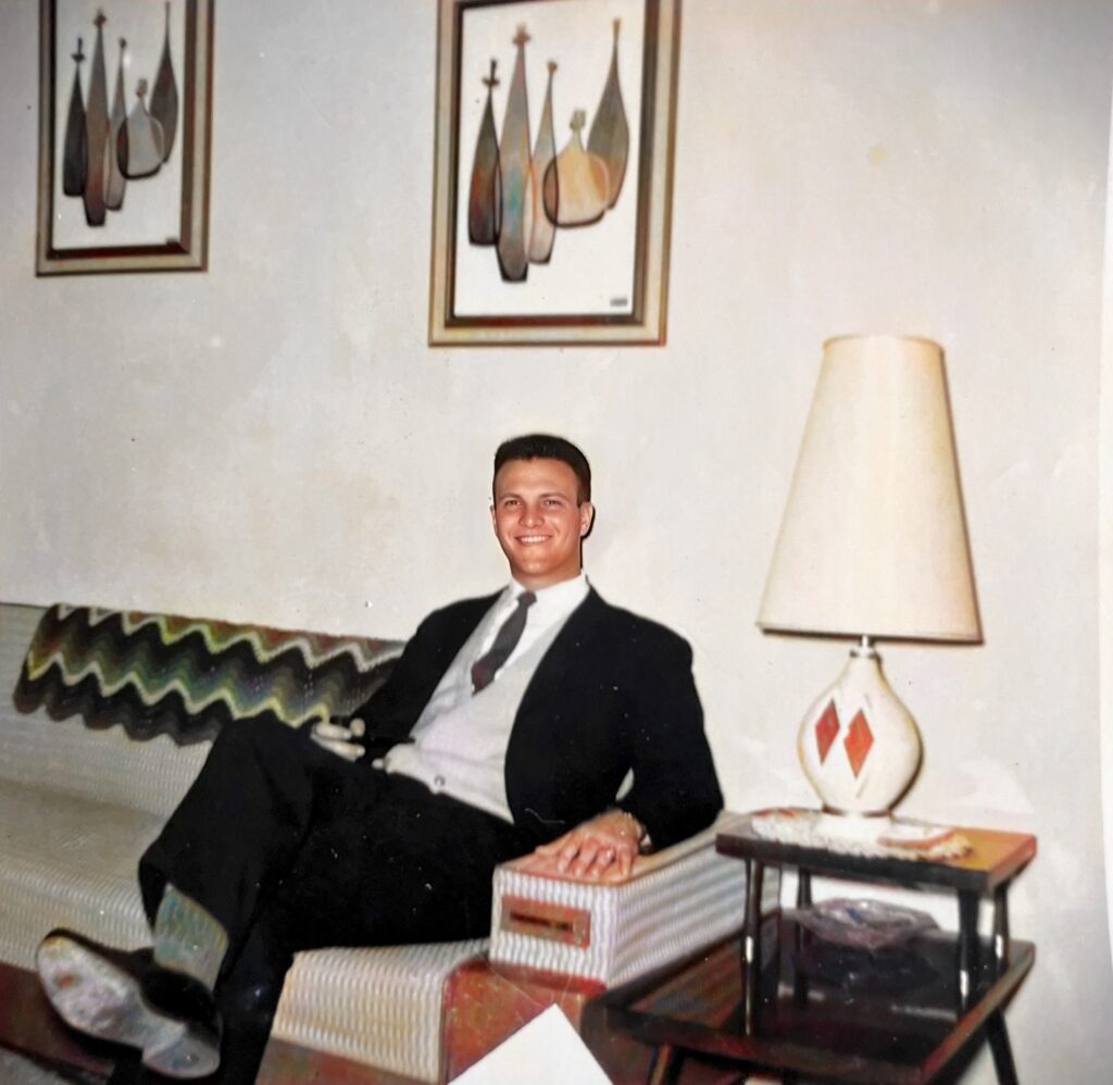 Dad in the living room of our post quarters at Fort Campbell, Kentucky.  Classic mid-century furniture and furnishings.  Autobiography of Dr. Anthony J. Carbone.