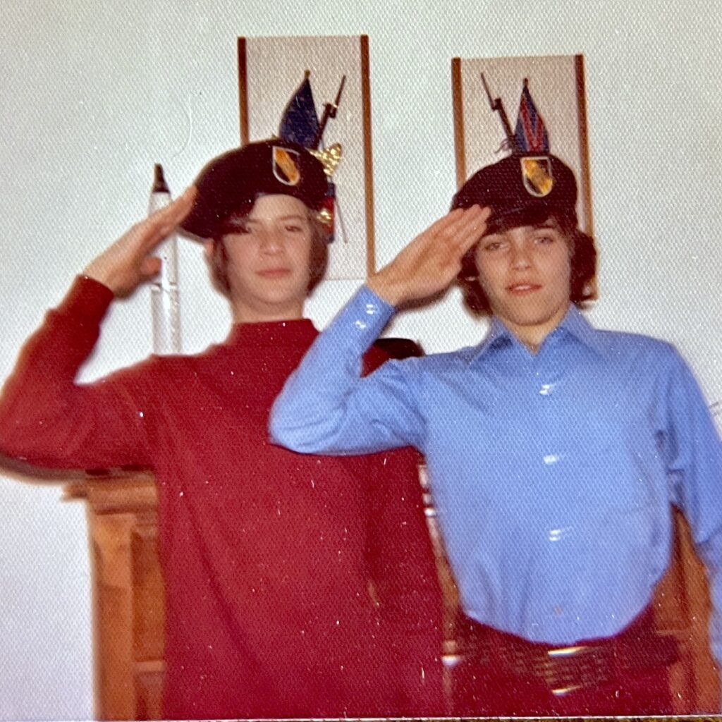Photograph of my cousin John Lakos when he visited us in Woodbridge, VA.  We are both wearing my father's green beret and saluting.  You can see a NASA model of a Mercury spaceship that was given to me from my Uncle Arthur McDonald, who worked for NASA and Grummun Aerospace.