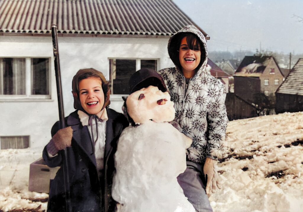 Lynne and Diana with their snowman in front of our house on the economy (off-post) in Fulda, West Germany. Our kindergarten and elementary school, run by German Catholic nuns, was right down the hill in our backyard.  Autobiography of Dr. Anthony J. Carbone.