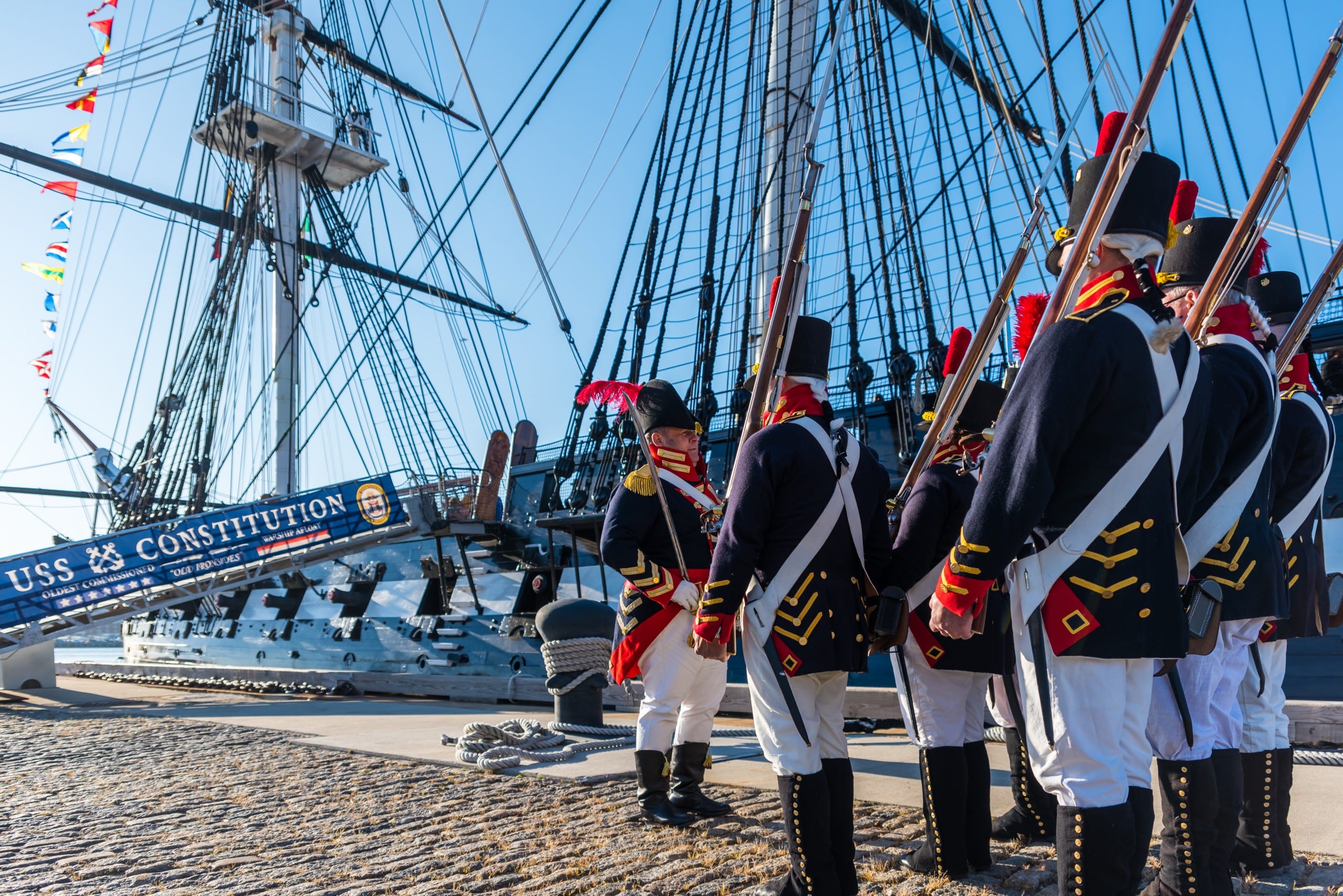 Photograph of the USS Constitution and ceremonial marine unit at Charlestown Naval Yard in Boston.  Autobiography of Dr. Anthony J. Carbone.