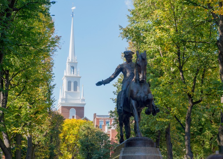 Photograph of the North End of Boston showing the statue of Paul Revere riding a horse with the Old North Church in the background.    Autobiography of Dr. Anthony J. Carbone.