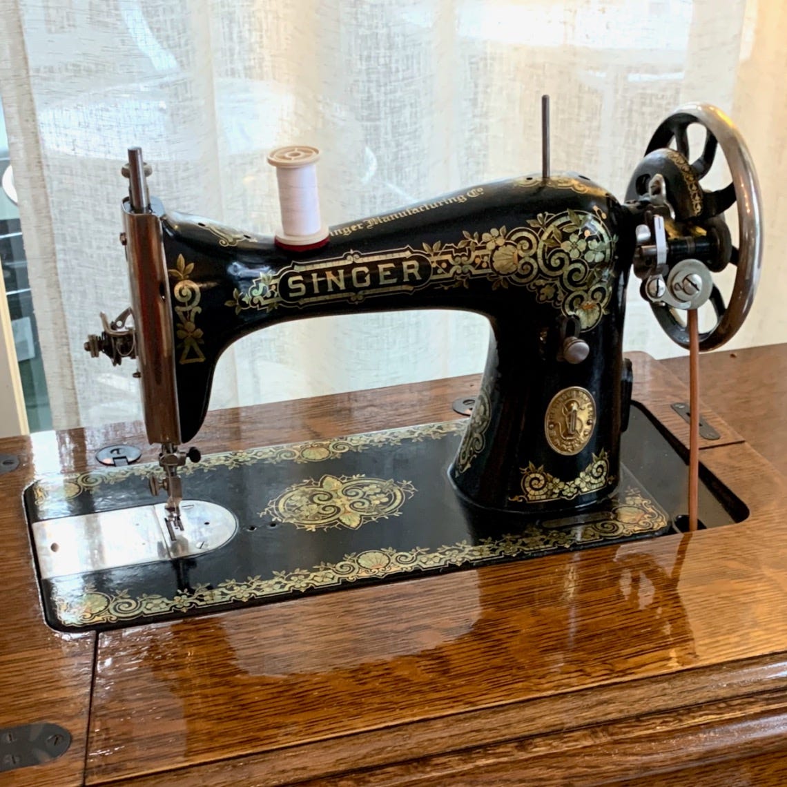 Photo of vintage Singer sewing machine on a wooden desk like my Papa Pietrantoni.Part of the autobiography of Dr. Anthony J. Carbone. Believe Nothing You Hear, and Only Half of What You See--A Memoir of Service, Shame, and the Search for Truth.
