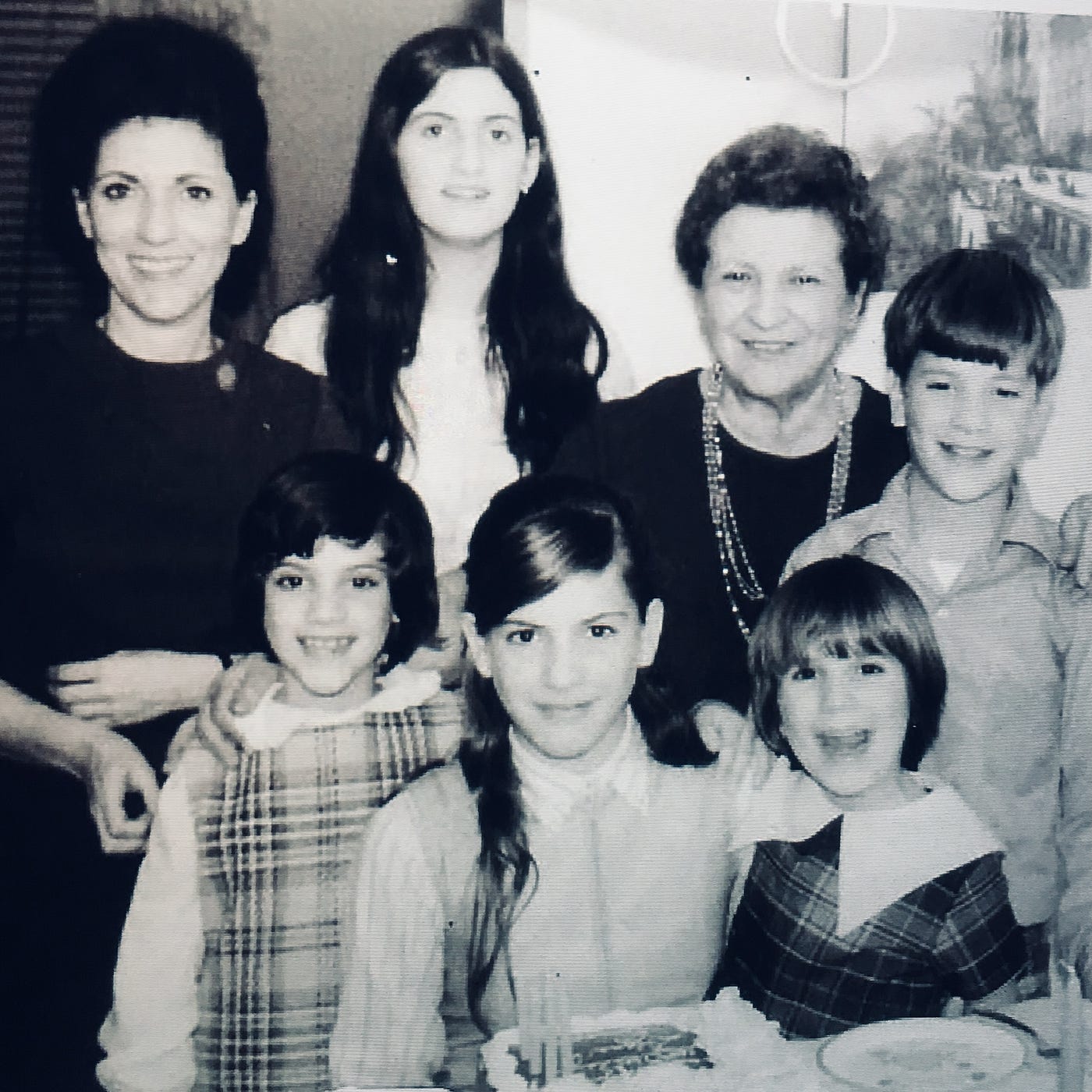 Photograph of Nana Carbone visiting us at our home in Mark Twain Village in Heidelberg, Germany.  With my mother (Edda Carbone), Sisters Lynne, Diana, Cynthia and Pamela Carbone.  Looks like it was my sister Diana's birthday with a birthday cake.  I am on the far left.Part of the autobiography of Dr. Anthony J. Carbone, Son in the Shadow of a Green Beret Hero