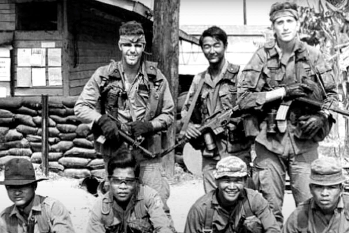 Photograph of a Typical MACV-SOG Team of 2 American Operatives and 5–12 Montagnard Soldiers.Part of the autobiography of Dr. Anthony J. Carbone, Son in the Shadow of a Green Beret Hero.