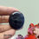 Thumbnail: Polished black banded agate cabochon with stylish layered crystal bands